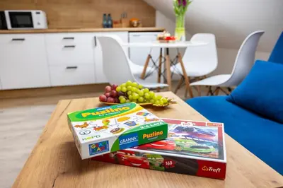 two boxes of cereal and grapes on a table at Aleja 69 in Kraków