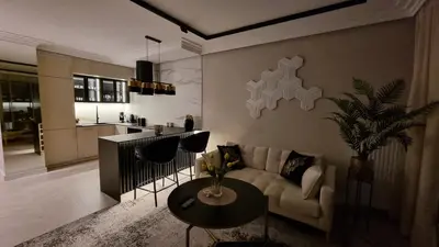 a living room with a couch and a table at Apartament Bulwary Oświęcim in Oświęcim