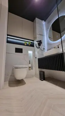 a bathroom with a toilet and a sink at Apartament Bulwary Oświęcim in Oświęcim