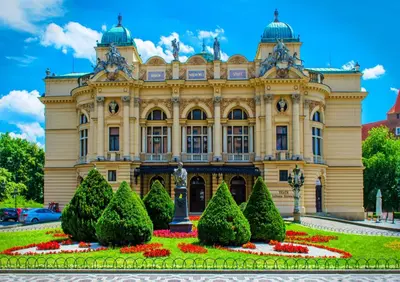 a building with a garden in front of it at Jacuzzi Kraków Bamboo in Kraków