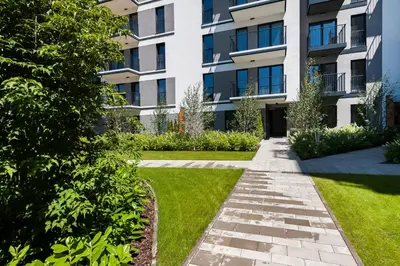 a walkway in front of a building at Krakowiak Apartment in Kraków