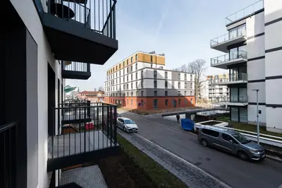 a view from a balcony of a parking lot with cars at Krakowiak Apartment in Kraków