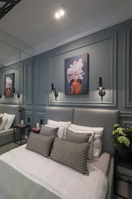 a bedroom with a large bed with pillows at Glamour Jacuzzi Apartment in Kraków