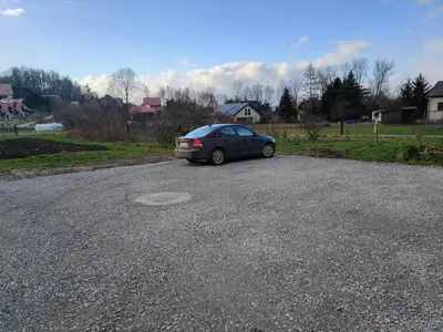 a car parked on the side of a road at Pokoje Kraków Tyniec Hostel in Kraków