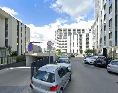 a row of cars parked on a street with buildings at Mogilska 120D by Homeprime in Kraków