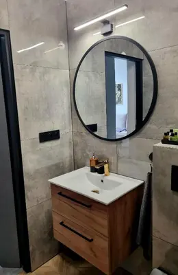 a bathroom with a sink and a mirror at Apartament Miodowa Street PARKING FREE in Kraków