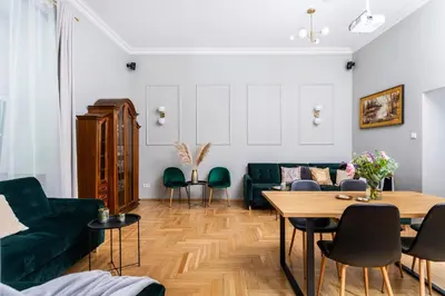 a living room with a couch and a table at Old Town Luxury Apartment - Rynek Szewska in Kraków