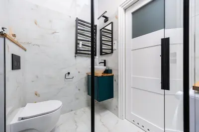 a bathroom with a toilet and a shower at Old Town Luxury Apartment - Rynek Szewska in Kraków