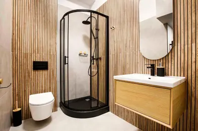 a bathroom with a shower and a sink and a toilet at Charming Studio with kitchen - Old Town, Main Station in Kraków