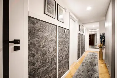 a hallway with a sliding glass door in a house at Charming Studio with kitchen - Old Town, Main Station in Kraków