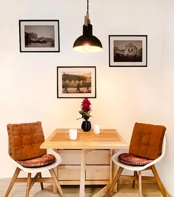 a dining room with a table and two chairs at 2-room Apartment with kitchen, heart of Cracow Old Town in Kraków