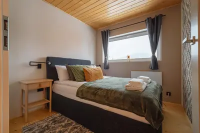 a small bedroom with a bed and a window at Beskidzkie Super Stodoły in Zawoja