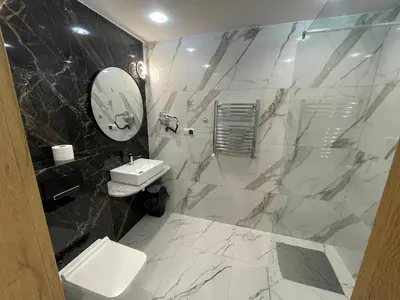 a bathroom with a sink and a mirror at Mały Książę in Podzamcze
