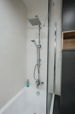 a bathroom with a shower with a glass door at Sky Mountain View Free Parking in Kraków