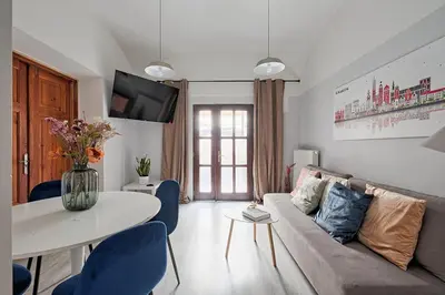 a living room with a couch and a table at Urban Nest Apartments Party Szewska21 in Kraków