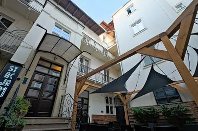 an umbrella is hanging outside of a building at Urban Nest Apartments Party Szewska21 in Kraków