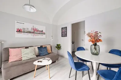 a living room with a couch and a table at Urban Nest Apartments Party Szewska21 in Kraków