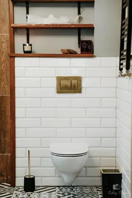 a bathroom with a white toilet in a room at Zaczarowana Furmanka in Antolka