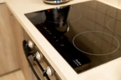 a coffee maker on a stove in a kitchen at THE SOUL of Nowa Huta - free garage in Kraków