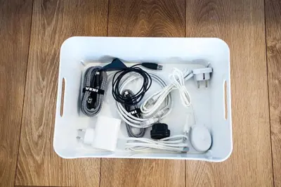 a white plastic container with electronics in it on a wooden floor at The Best Location in Cracow for City Break in Kraków