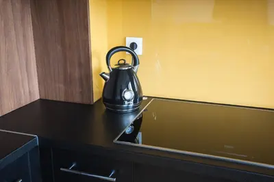 a tea kettle sitting on top of a kitchen counter at The Best Location in Cracow for City Break in Kraków