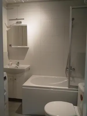 a bathroom with a tub and a toilet and a sink at U Cioci in Kraków