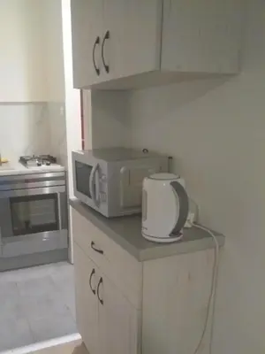 a kitchen with a microwave and a toaster oven at U Cioci in Kraków