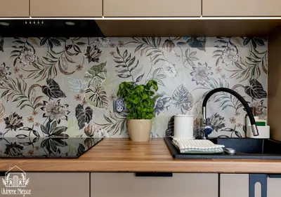 a kitchen counter with a sink and a flower wallpaper at ULUBIONE MIEJSCE ZATOR in Zator
