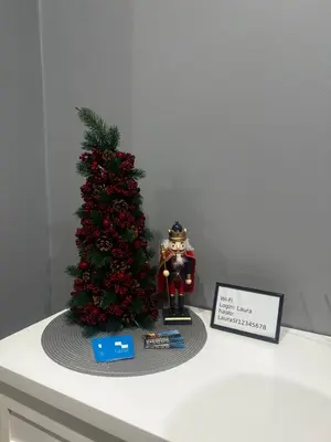 a small christmas tree and a figurine on a table at Apartament z Jacuzzi Kraków SHINE Starowiślna in Kraków
