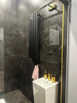 a bathroom with a sink and a mirror at Apartament z Jacuzzi Kraków SHINE Starowiślna in Kraków