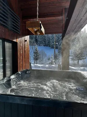 a jacuzzi tub in a house with a window at ObidovaGorce in Obidowa