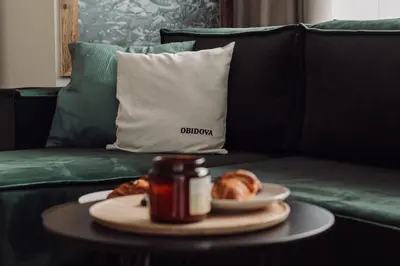 a table with a plate of croissants on a couch at ObidovaGorce in Obidowa
