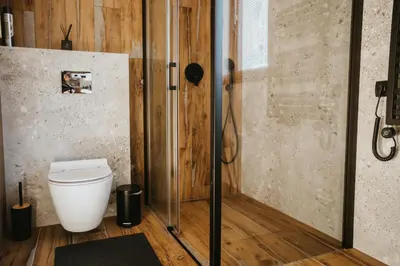 a bathroom with a toilet and a shower at ObidovaGorce in Obidowa