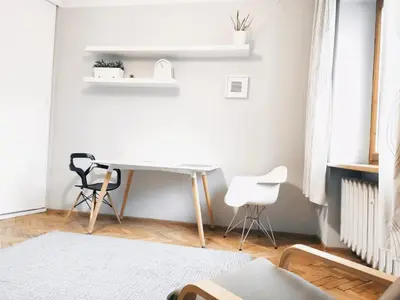 a room with a desk and two chairs at Daszyńskiego 7 by Homeprime in Kraków