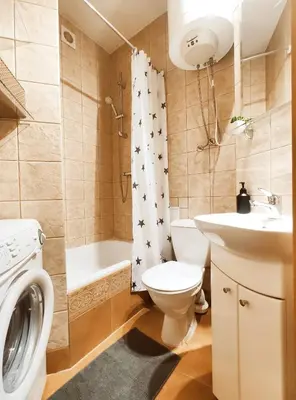 a bathroom with a toilet and a sink and a shower at Daszyńskiego 7 by Homeprime in Kraków