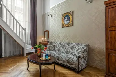 a living room with a couch and a table at The Spiski Palace Apartments in Kraków