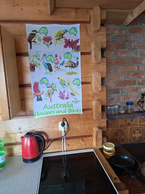 a sign on a wall above a kitchen sink at Urokliwy drewniany dom z widokiem na Tatry in Tokarnia