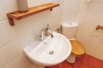 a bathroom with a white sink and a toilet at Kraków Old Town - Kazimierz Dajwór in Kraków