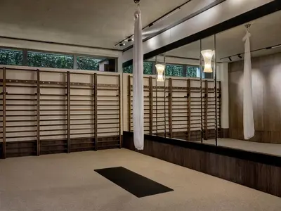 a large room with wooden blinds on the windows at Stradom House, Autograph Collection in Kraków