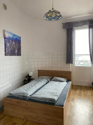 a bedroom with a large bed in a room at Vintage Rooms in Old Town in Kraków
