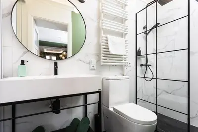 a bathroom with a sink and a mirror at Verdant Oasis - Old Town Studio - by Upstairs in Kraków