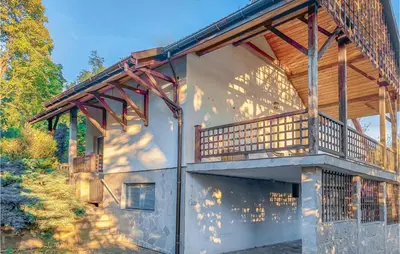 a house with a deck on the side of it at 6 Bedroom Amazing Home In Mucharz in Mucharz