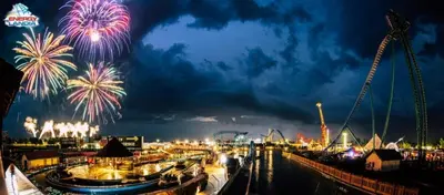 a firework display at an amusement park at night at ApartPark Centrum Zator Bronze in Zator