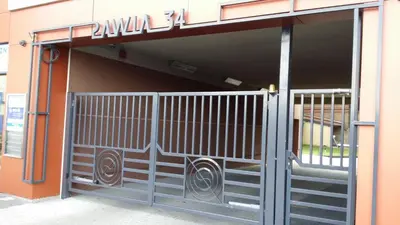 an entrance to a building with a gate at atHome in Kraków