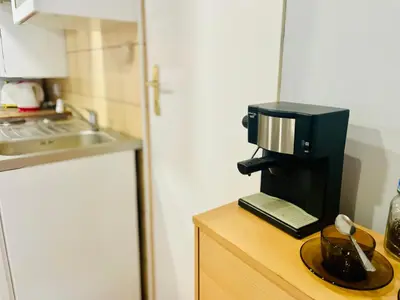a coffee maker on a counter in a kitchen at Sebastiana Studio Old Town in Kraków