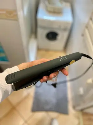 a person holding a wii remote in their hand at Sebastiana Studio Old Town in Kraków