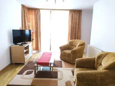 a living room with a couch and a tv at Kazimierza Wielkiego 84 by Homeprime in Kraków