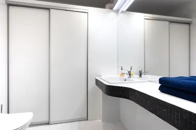 a bathroom with a sink and a mirror at Apartment Kazimierz near Wawel Castle in Kraków