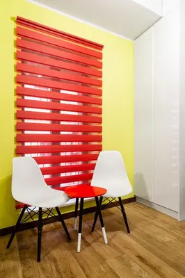 two white chairs and a red table in a room at Househost Apartment:Bracka 3/15A in Kraków