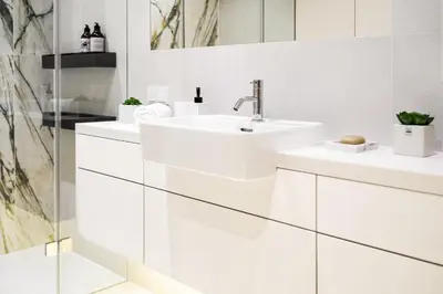 a white bathroom with two sinks and a mirror at Premium Designer Apartment - Quiet and Central in Kraków